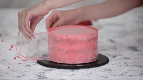Chef Unwraps Delicious Pink Frosted Cake