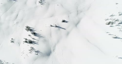Skier skiing on a snow capped mountain 4k