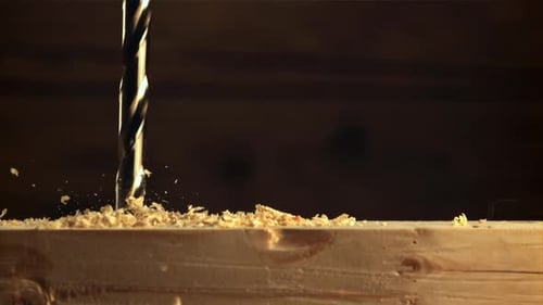 Drill Bit Drilling into Wood Close Up