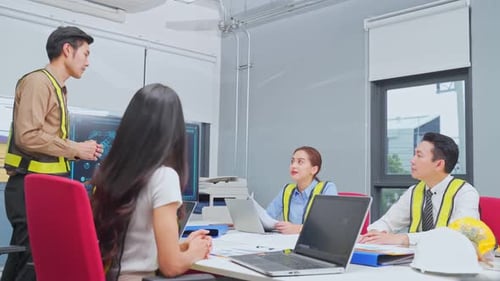 Asian young business people group have discussion meeting about robot technology in office.