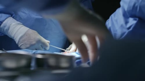 Hands of Surgeon Operating on Patient