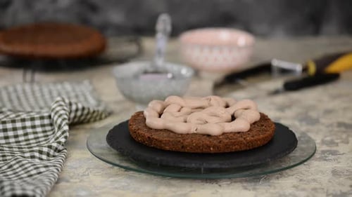 Icing Cake Layer with Chocolate Frosting