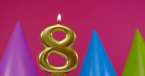 Gold Number Eight Birthday Candle with Party Hats