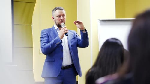 Man Giving Speech at a Corporate Conference