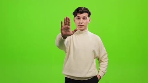 Man Stop Gesture on Green Screen Background