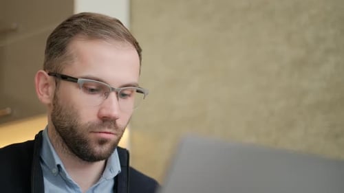 Man Working on Computer in an Office