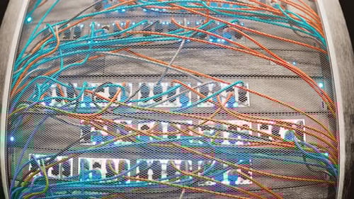 Network Server Rack with Blinking Lights and Intertwined Cables