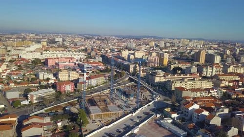 Aerial View of City Construction Site with Cranes