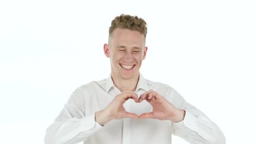 Man with Curly Hair Makes Heart Shape with Hands