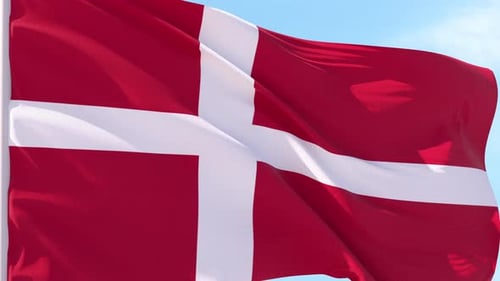Denmark Flag Waving Against a Clear Blue Sky