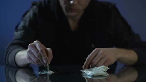 Drug Addict Forming Cocaine Lines on Table, Dangerous Substance Dependence