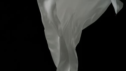 Elegant White Fabric Flowing on Black Background