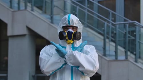 Adult in Hazmat Suit Showing Okay