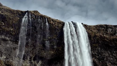 Majestic Waterfall Cascading Down Rocky Cliff Face