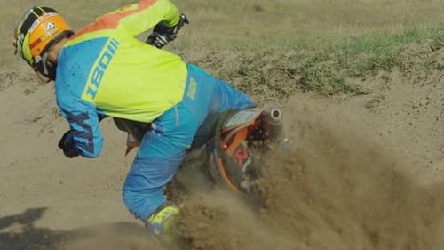 Motocross Rider Drifting on Rural Dirt Track