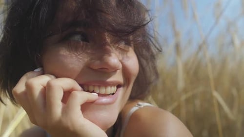 Portrait Woman with Short Hair on the Wheat Field
