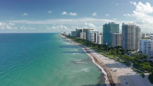 Aerial View on White Sand Beach at Miami South Bay. Tropical Nature at Sunset