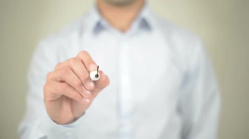 Man Writes Mentor on Clear Surface with Marker
