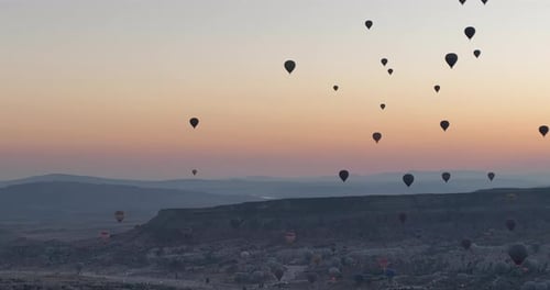 Aerial Cinematic Drone View of Colorful Hot Air Balloon Flying Over Cappadocia