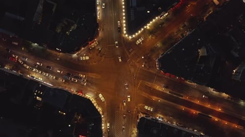 AERIAL: Birds View of Big Intersection Traffic at Night in Berlin, Germany Rosenthaler Platz Street