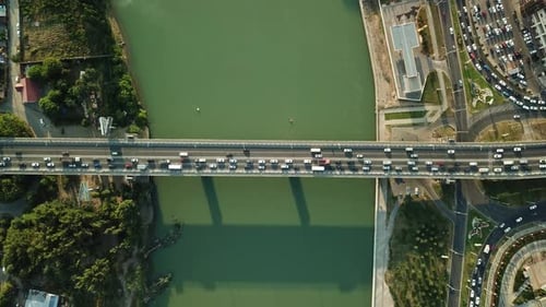 Aerial Top Down View From Drone of Traffic Bridge City with Driving Car