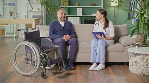 Male Patient Talking with Home Healthcare Nurse