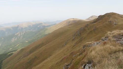 Slow tilt over valley under Midzor peak 4K 2160p 30fps UltraHD footage - Tilting on mountain ranges