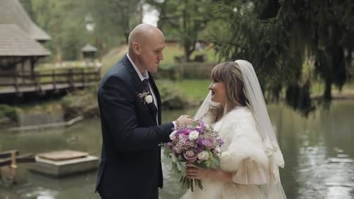 Caucasian Groom with Bride in the Park. Wedding Couple. Happy Family. Newlyweds