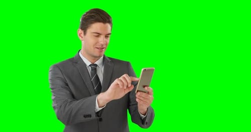 Smiling Man Using Mobile Phone on Green Screen