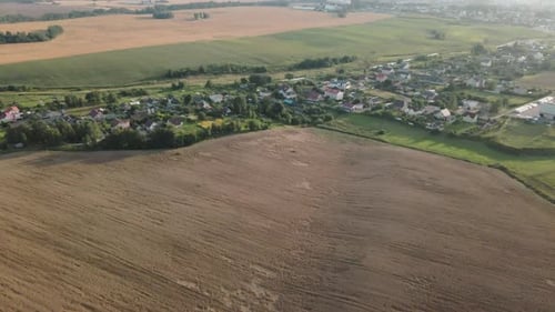 A small village surrounded by agricultural fields.