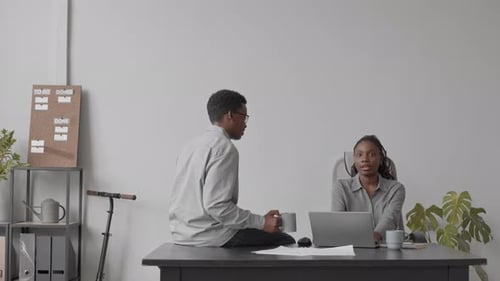 Software Developers Chatting in Office