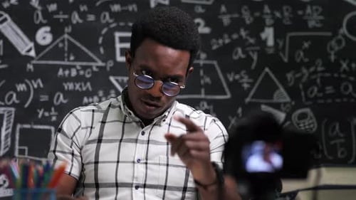 Close-up angry African American teacher talk in front of camera