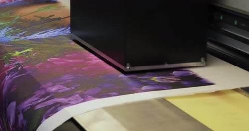 Printing machine prints colorful picture close up