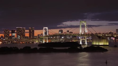 Time Lapse looking across Tokyo Bay at the Rainbow Bridge and Tokyo