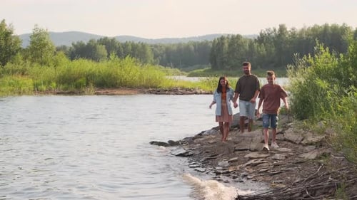Family Walking on Lake Shore