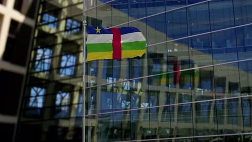 Central African Republic Flag Waving in Front of Modern Corporate Building