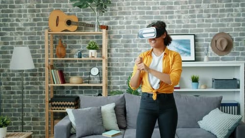 Woman Using Virtual Reality Headset at Home