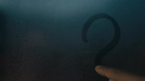Finger Drawing Question Mark on Steamy Window