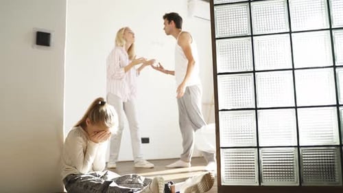 Family Conflict with Arguing Parents and Sad Child