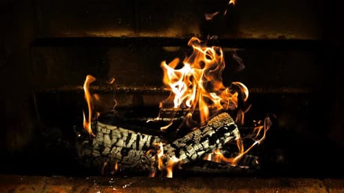 Glowing Fire in Dark Fireplace