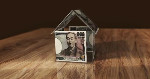 Japan Yen 10000 JPY money banknotes paper house on the table