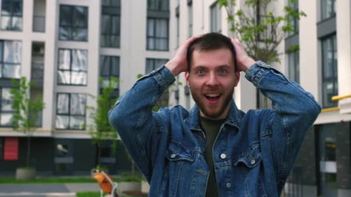 Surprised Man Gesturing in Urban Setting