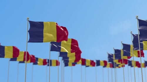 Many Waving Romanian Flags Against Clear Blue Sky