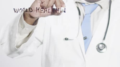 Doctor Writes World Health Day on Clear Surface