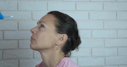 Adult Woman Receiving Nasal Swab Close Up