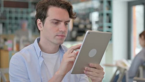 Man Using Tablet, Celebrating Success