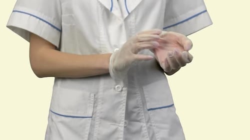 Female Doctor Pulling Up Rubber Gloves to Put Them Up