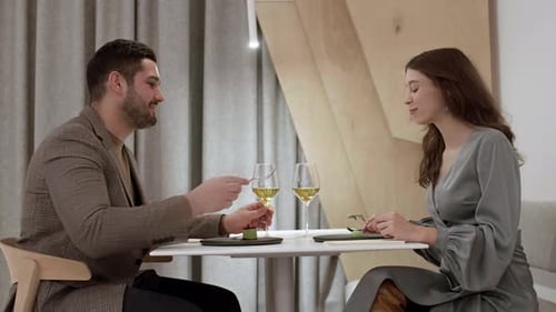 Young Couple Dining in Restaurant