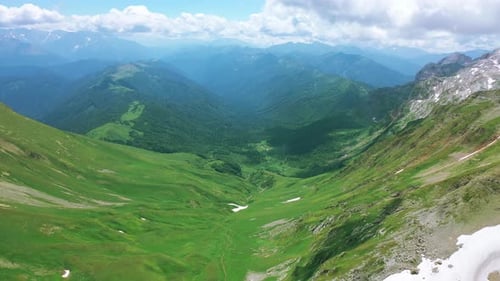 Aerial View of Valley Among Beautiful Mountains of Caucasus, Stunning Gorge Covered with Green Grass