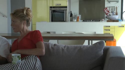 Couple Discussing Paperwork at Home